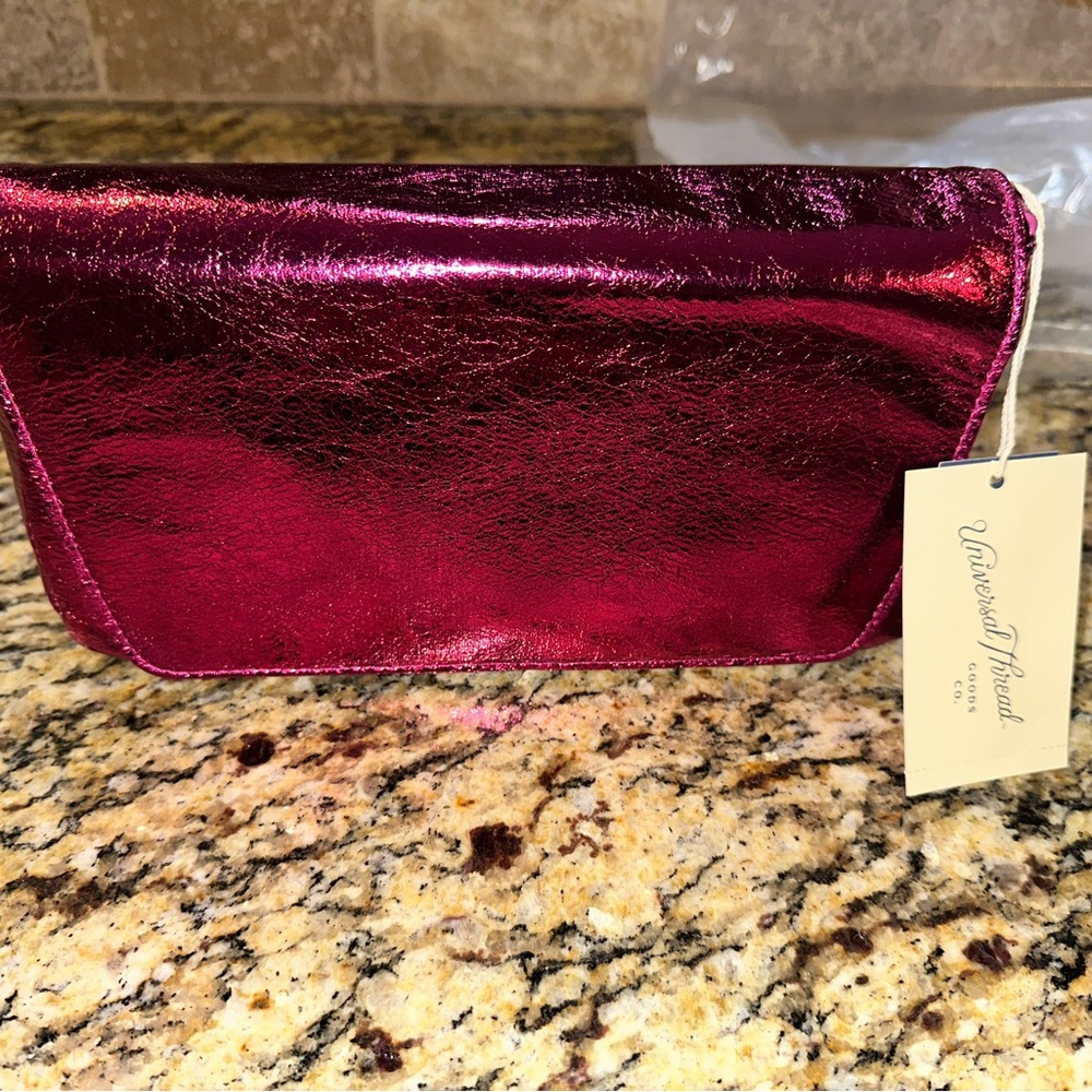 Metallic pink clutch and crossbody